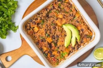 Baked Quinoa with cubed sweet potatoes, canned black beans, diced tomatoes, vegetable broth, and taco seasoning