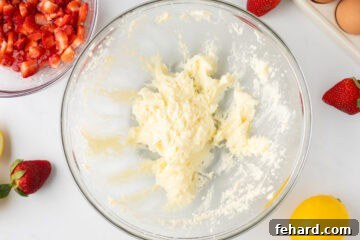 Butter and sugar creamed together for strawberry quick bread in large mixing bowl.