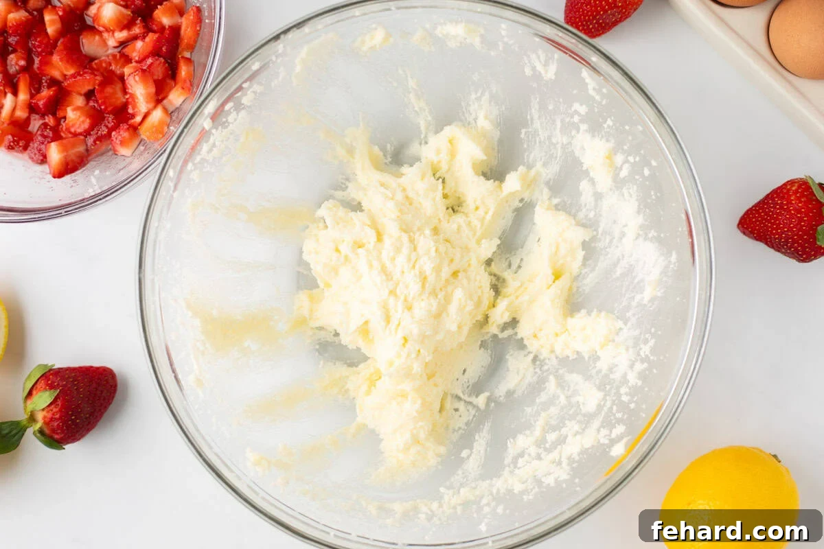 Butter and sugar creamed together for strawberry quick bread in large mixing bowl.