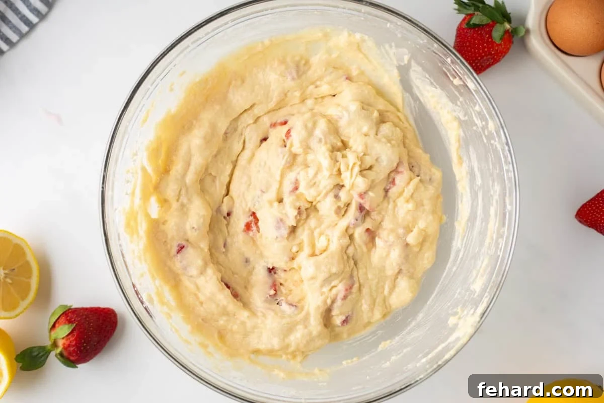 Batter for strawberry quick bread in large mixing bowl. 