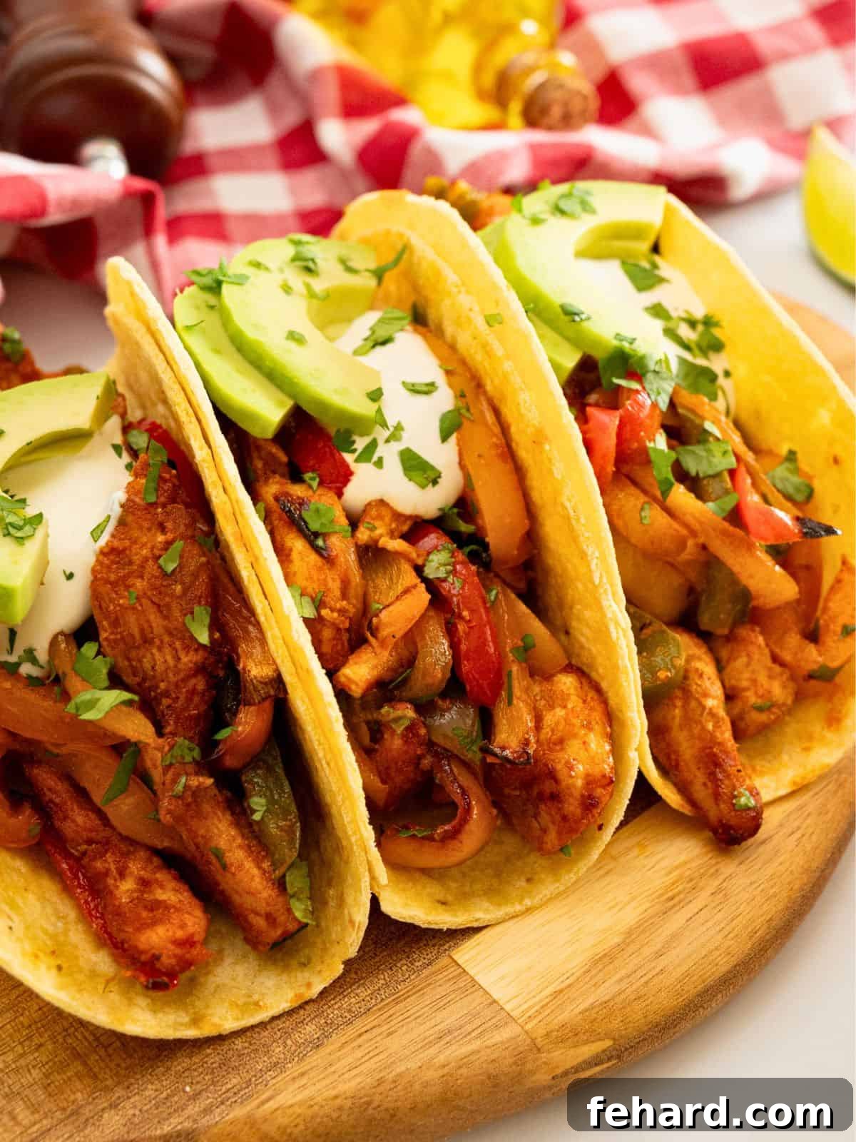 Beautifully roasted chicken, peppers, and onions served in soft tortillas, garnished with sour cream, avocado slices, and fresh minced cilantro.