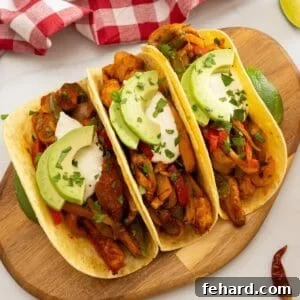 Roasted chicken, peppers and onions served in tortillas with sour cream and avocado and minced cilantro.