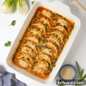 Potstickers baked in curry-soy coconut broth with sliced bok choy topped with chili crisp, green onions, and sesame seeds.