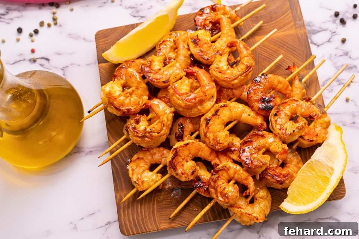 Honey Garlic Grilled Shrimp Skewers on wooden platter.