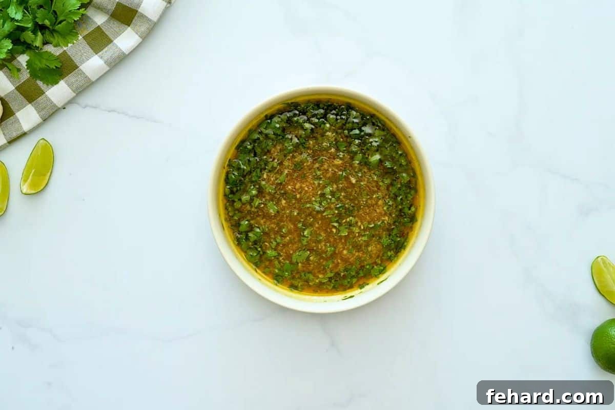 Honey, olive oil, garlic, cilantro, and lime zest and lime juice mixed together for chicken marinade.