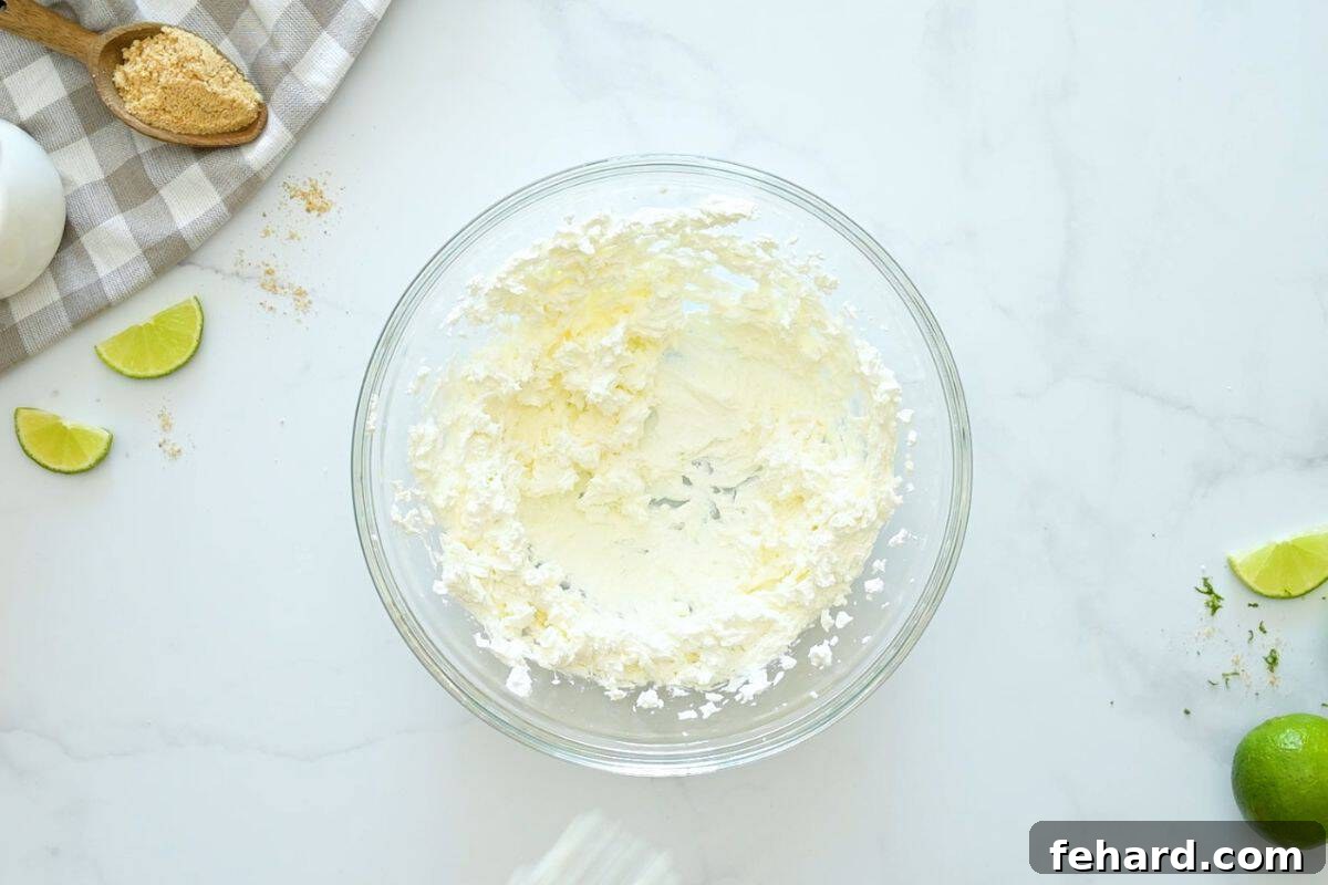 Best Key Lime Pie recipe Cream cheese blended in large mixing bowl until creamy and smooth.