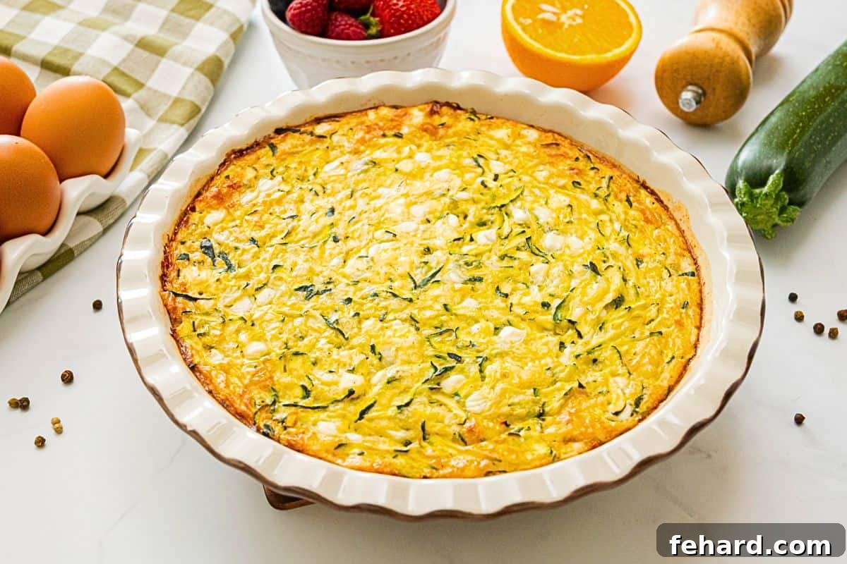Zucchini Egg Bake with Cottage Cheese Crustless zucchini pie made with shredded zucchini, grated onion, cottage cheese and eggs baked in white ceramic pie dish.