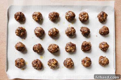 baked meatballs on a baking sheet
