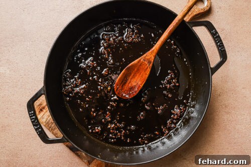 honey and garlic in a cast iron skillet