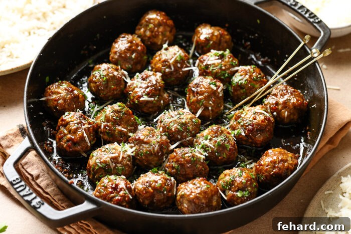 closeup view of honey garlic meatballs in a cast iron skillet 